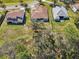 Birds-eye view of the backyard layouts with spacious, well-maintained lawns and mature trees at 8064 Peaceful Cir, Sanford, FL 32771