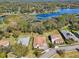 Picturesque aerial view featuring waterfront homes with mature landscaping and serene lake backdrop at 8064 Peaceful Cir, Sanford, FL 32771