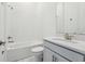 Modern bathroom with a tub, shower, vanity, and sleek fixtures, offering comfort and style at 8064 Peaceful Cir, Sanford, FL 32771