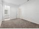 Bright bedroom features neutral carpet and leads to an ensuite bathroom at 8064 Peaceful Cir, Sanford, FL 32771