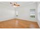 Bright bedroom with natural light, ceiling fan and hardwood floors at 8064 Peaceful Cir, Sanford, FL 32771