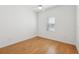 Bedroom featuring wood floors, a ceiling fan, and a window for natural light at 8064 Peaceful Cir, Sanford, FL 32771