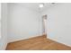 Bedroom featuring wood floors, a ceiling fan, and an open doorway to another room at 8064 Peaceful Cir, Sanford, FL 32771