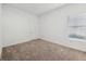 Cozy bedroom featuring neutral carpet, a window with blinds, and a closet at 8064 Peaceful Cir, Sanford, FL 32771