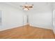 Bright bedroom with natural light, ceiling fan and hardwood floors at 8064 Peaceful Cir, Sanford, FL 32771