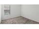 Cozy bedroom with plush carpet flooring and a large window for natural light at 8064 Peaceful Cir, Sanford, FL 32771