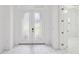 Bright foyer featuring a double door entry and white marble tile flooring at 8064 Peaceful Cir, Sanford, FL 32771