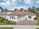 Elegant home with a three car garage, paver driveway, and manicured landscaping at 8064 Peaceful Cir, Sanford, FL 32771