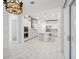 Spacious kitchen featuring white cabinetry, stainless steel appliances, a center island, and marble flooring at 8064 Peaceful Cir, Sanford, FL 32771
