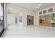 The light bright lanai features access to the kitchen and views of the exterior through large windows at 8064 Peaceful Cir, Sanford, FL 32771