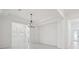 Bright living room with marble tile flooring and modern chandelier at 8064 Peaceful Cir, Sanford, FL 32771