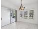 Dining area features marble flooring and a view of the lanai at 8064 Peaceful Cir, Sanford, FL 32771