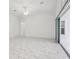 Spacious open living area with marble flooring, recessed lighting, and sliding glass doors at 8064 Peaceful Cir, Sanford, FL 32771