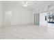 Large, bright living area with marble flooring, recessed lights, and patio access at 8064 Peaceful Cir, Sanford, FL 32771