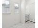 Room with marble floors, two windows, and a door at 8064 Peaceful Cir, Sanford, FL 32771
