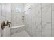 Bright bathroom features a tiled shower with a built-in bench and dual showerheads at 8064 Peaceful Cir, Sanford, FL 32771