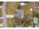 Aerial view of the property showcasing a home, driveway, backyard, and swimming pool at 1012 E De Carlo Dr, Deltona, FL 32725