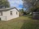 View of the fenced backyard with an additional storage building at 1130 E Bay St, Winter Garden, FL 34787