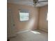 This empty bedroom features light walls and a window for natural light at 1130 E Bay St, Winter Garden, FL 34787