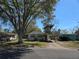 Charming single-story house featuring a carport and mature trees in a residential area at 1130 E Bay St, Winter Garden, FL 34787