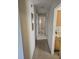 Hallway view showing doorways, light fixtures, and an electrical panel at 1130 E Bay St, Winter Garden, FL 34787