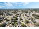 Expansive aerial view of the neighborhood showcasing tree-lined streets and varied home styles at 1183 Feather Dr, Deltona, FL 32725