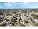 Aerial view of the property and surrounding neighborhood outlined in red at 1183 Feather Dr, Deltona, FL 32725