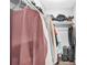 Walk-in closet with an arrangement of clothes hanging from a rod at 1183 Feather Dr, Deltona, FL 32725