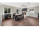 Dining room featuring hardwood floors, a modern fireplace, and lots of natural light at 1183 Feather Dr, Deltona, FL 32725