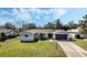 Charming home showcasing a well-manicured lawn and a two-car garage at 1183 Feather Dr, Deltona, FL 32725