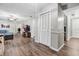 Hallway with wood-look floors, white closet, and neutral wall color at 1183 Feather Dr, Deltona, FL 32725