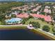 Beautiful aerial view of community with a swimming pool, lake, and clubhouse at 11846 Nautica Dr, Orlando, FL 32827