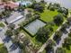 Aerial view of outdoor basketball court surrounded by mature trees and lush landscaping at 11846 Nautica Dr, Orlando, FL 32827