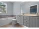 Bathroom featuring a tub, toilet, and vanity at 11846 Nautica Dr, Orlando, FL 32827