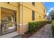 Side exterior of the house, featuring walkway and greenery with lanai in background at 11846 Nautica Dr, Orlando, FL 32827