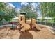 Community playground features a colorful slide set amidst lush landscaping, offering a safe and fun play area for children at 11846 Nautica Dr, Orlando, FL 32827