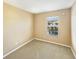 Empty bedroom features carpeted floors and a window at 1260 Honey Blossom Dr, Orlando, FL 32824