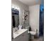 Cozy bathroom with floral accents, offering a blend of comfort and style at 131 San Blas Ave, Kissimmee, FL 34743