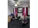 Bedroom with fan and abundant sunlight, accented by a decorative art piece at 131 San Blas Ave, Kissimmee, FL 34743