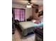 Well-lit bedroom featuring a comfortable bed and tasteful decorative accents at 131 San Blas Ave, Kissimmee, FL 34743