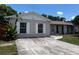 Charming single-story home featuring a spacious driveway and well-maintained front yard at 131 San Blas Ave, Kissimmee, FL 34743
