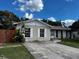 Charming single story home featuring a concrete driveway and light colored facade at 131 San Blas Ave, Kissimmee, FL 34743