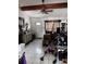 Cozy living room with vaulted ceiling, complete with tile floor and a ceiling fan at 131 San Blas Ave, Kissimmee, FL 34743