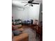 Cozy living room featuring hardwood floors and comfortable seating arrangement at 131 San Blas Ave, Kissimmee, FL 34743