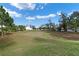 View of the expansive green backyard with ample space for recreation and leisure activities at 1335 E 10Th St, Apopka, FL 32703