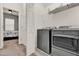 Laundry room featuring gray appliances and shelving at 1335 E 10Th St, Apopka, FL 32703