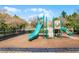 Outdoor playground with a green slide and other climbing structures at 1335 E 10Th St, Apopka, FL 32703