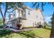 Two-story home featuring a manicured lawn and a paver walkway leading to the entrance at 1335 E 10Th St, Apopka, FL 32703