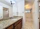 Bathroom with single sink vanity, large mirror and shower/tub combo at 136 Raintree Dr, Longwood, FL 32779