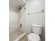 Bright bathroom featuring tile shower with updated shower head and white toilet at 136 Raintree Dr, Longwood, FL 32779